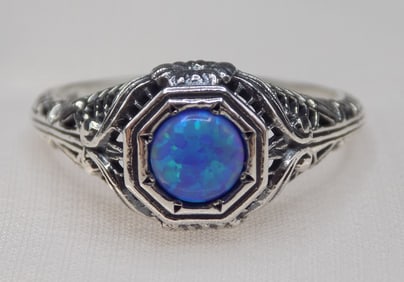 Beautiful ½ ct blue fire opal sterling silver ring.
