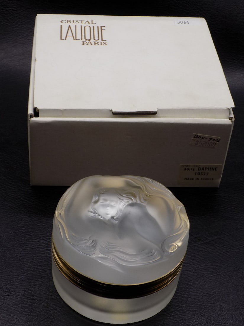 Vintage signed Lalique Dalphne art glass jewelry box.: Vintage signed Lalique Dalphne art glass jewelry box. Original box. Lid is unattached as shown in photo. Has small chip below base of hinge. Great quality and detail. 1 7/8 inches tall x 3 1/8 inches 