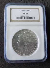 Uncirculated 1904 O graded MS63 Morgan silver dollar by NGC