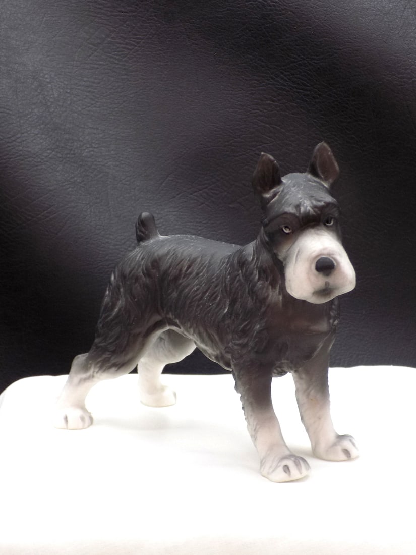 Vintage porcelain Schnauzer dog figure: Vintage porcelain Schnauzer dog figure. Numbered on bottom as shown in photo. Beautiful colors. Great quality and detail. In very good original as found condition. 4 ¾ inches tall x 6 ¼ 