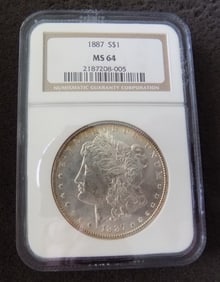 Uncirculated 1887 graded MS64 Morgan silver dollar by NGC.