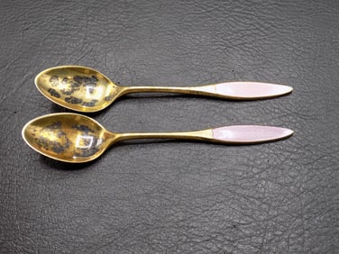 Two vintage Guilloche gold washed sterling spoons.