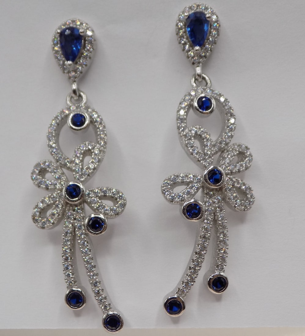 Beautiful pair of sapphire and topaz sterling silver earrings: Beautiful pair of sapphire and topaz sterling silver earrings. Great quality and detail. 1 ¾ inches long