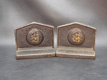 Pair of vintage bookends with classical scene. Looks to be bronze