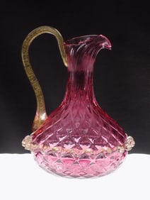 Vintage cranberry art glass cruet with gold dust handle