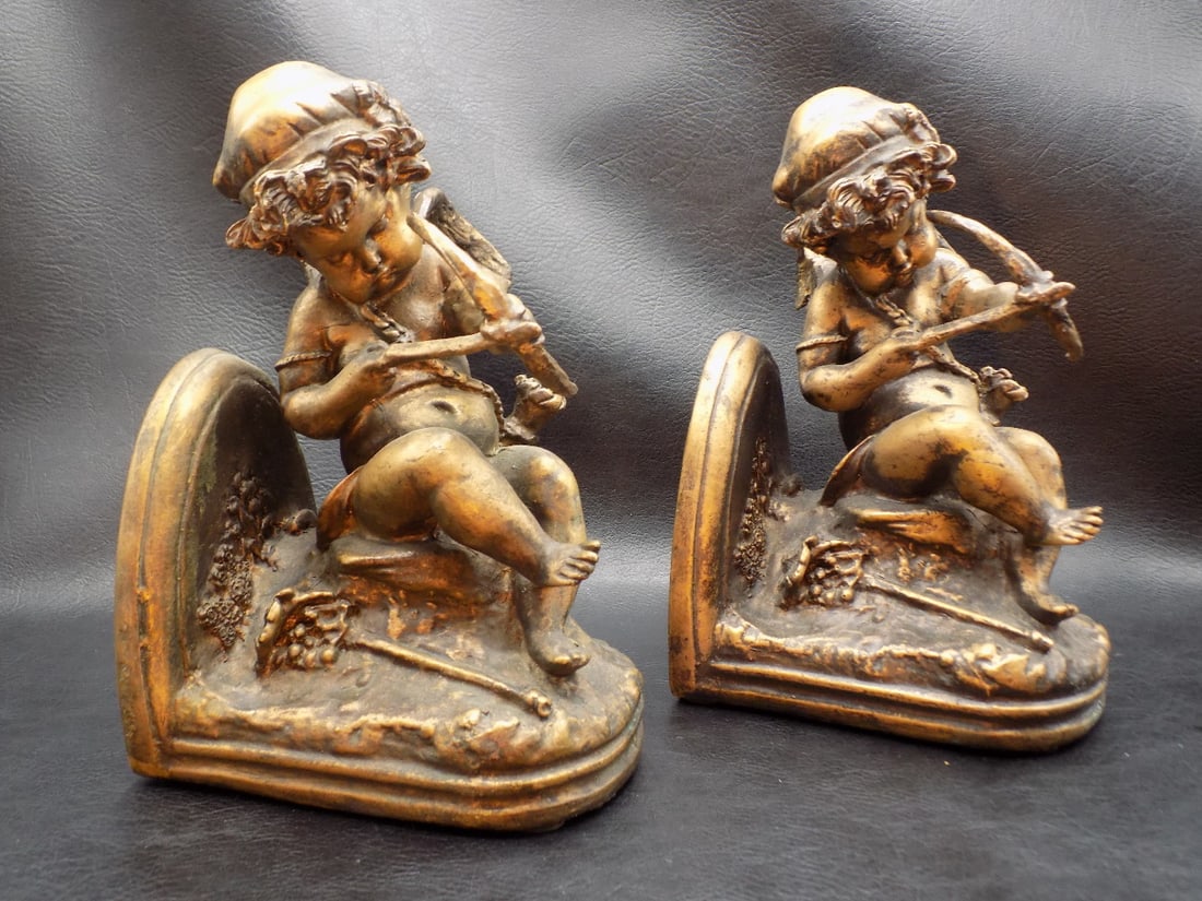 Charming pair of Cupid bookends.: Charming pair of Cupid bookends. Beautiful colors. Great quality and detail. In very good original condition. 7 3/8 inches tall x 4 ¾ long x 3 ½ inches wide