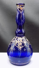 Victorian enamel decorated art glass barber bottle in cobalt blue.