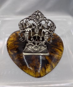 Ornate antique paper clip or note clip with cupids on heart shaped tortoise shell colored base