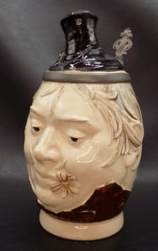 J. W. Remy #765 commonly referred to as Man’s Head with Flower.