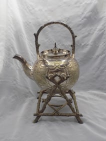 Ornate antique teapot with stand