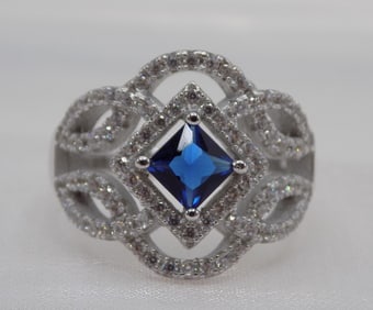 Beautiful 1 cwt blue sapphire and white topaz sterling silver ring.