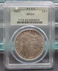 Uncirculated 1887 MS64 Graded Morgan silver dollar by PCGS