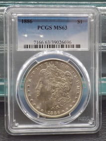 Uncirculated 1886 MS63 Graded Morgan silver dollar by PCGS.