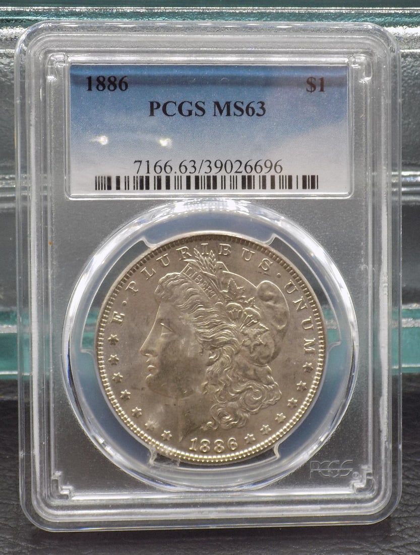 Uncirculated 1886 MS63 Graded Morgan silver dollar by PCGS. (1 of 4)
