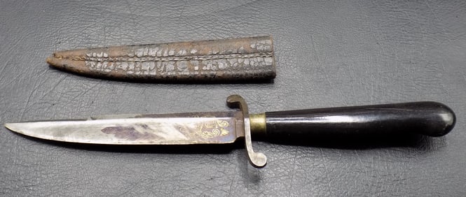Antique boot knife and sheath.