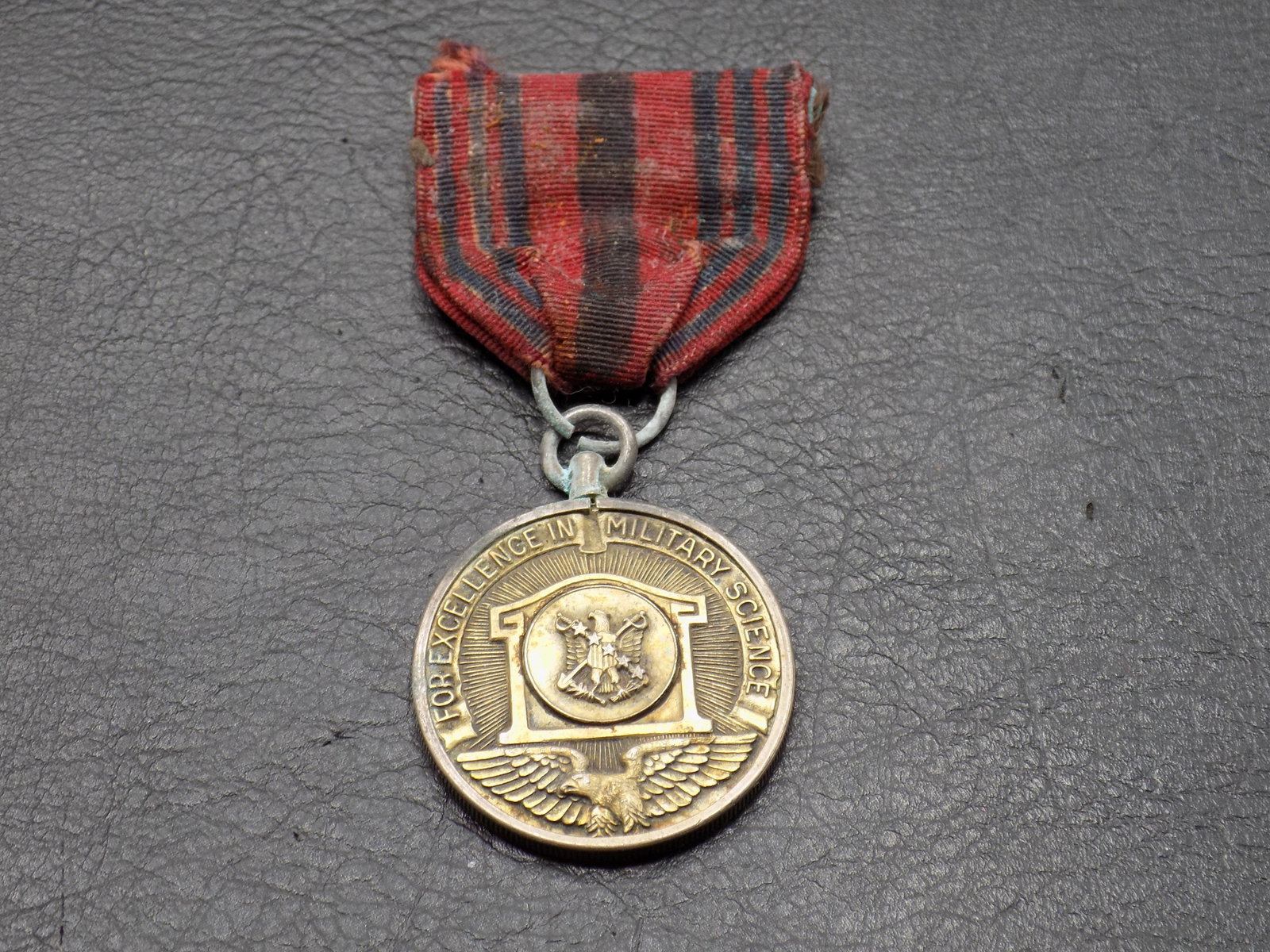 1950 military medal and ribbon: 1950 military medal and ribbon. For Excellence in Military Science. Please see photos. 3 inches long. Medal 1 ¼ inches.