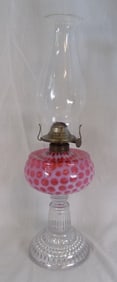 Antique cranberry white opalescent coin spot kerosene lamp.