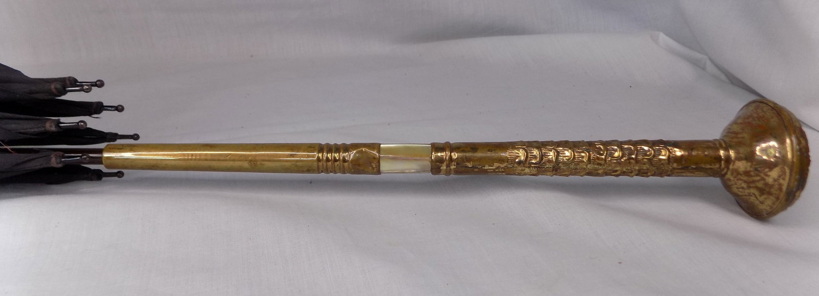 Antique decorated gold filled with mother of pearl handle umbrella: Antique decorated gold filled with mother of pearl handle umbrella. No markings. Great quality and detail. In very good original as found condition with tarnish as shown in photos. 40 inches.