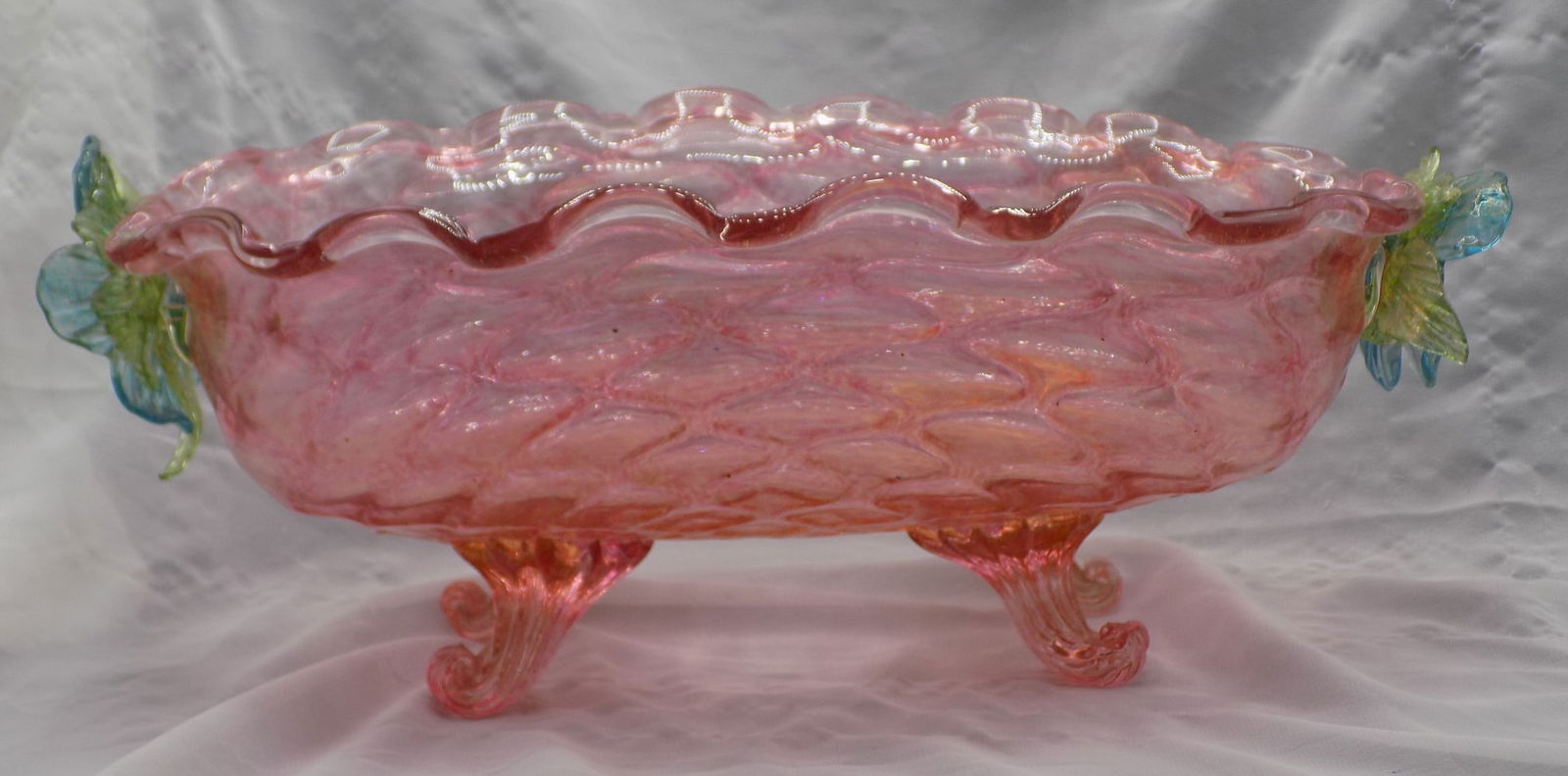 Lovely vintage Venetian style art glass bowl: Lovely vintage Venetian style art glass bowl. Applied flowers. Gold dust interior. Hand blown. Has a broken leaf on flower as shown in photo. 14 1/8 long x 8 ¼ width x 5 3/8 inches tall.