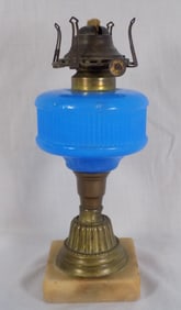 Pretty antique blue art glass kerosene lamp with brass and marble base.