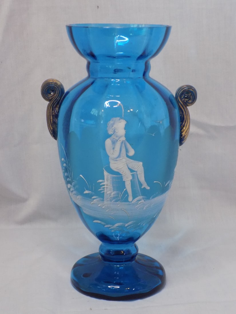 Elegant antique hand decorated art glass vase: Elegant antique hand decorated art glass vase Blue glass with child . Beautiful colors. Great quality and detail. In very good original as found condition. 9 1/4 inches tall. White dots are camera ref