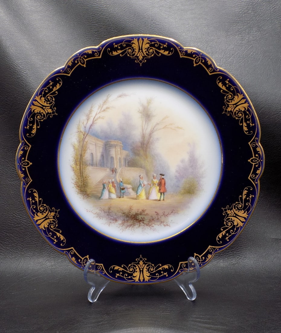 Beautiful hand decorated Sevres plate: Beautiful hand decorated Sevres plate. Marked on back as shown in photo. Gold enamel decorated border. In very good original as found condition. Great quality and detail. 9 ½ inches. wide. For 