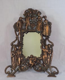 Antique cast metal figural dressing mirror