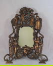 Antique cast metal figural dressing mirror