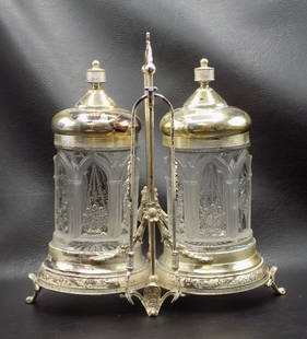 Splendid ornate double castor set.: Splendid ornate double castor set. Marked Simpson Hall and Miller as shown in photo. Silver plate. Fancy tongs. Three dimensional decoration in castors. In very good original as found condition. Has w
