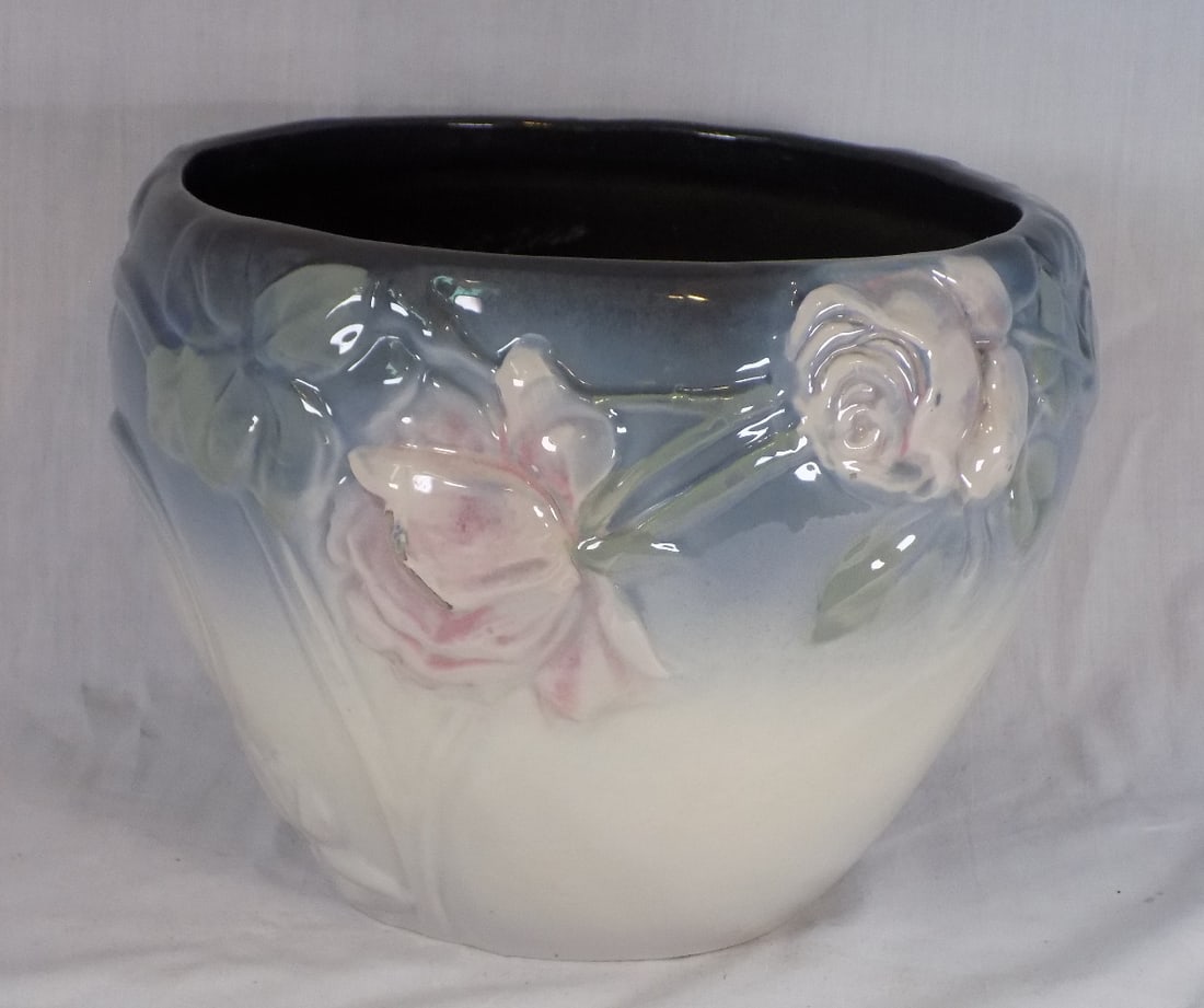 Beautiful rose decorated Weller art pottery jardinière: Beautiful rose decorated Weller art pottery jardinière. Marked on bottom as shown in photo. Has a small fleabite chip on backside as shown in photo. Otherwise, in very good original as found conditio