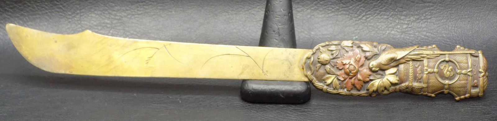Fancy antique bronze letter opener with parrot in flowers: Fancy antique bronze letter opener with parrot in flowers. Decorated on both sides. In very good original as found condition. Great quality and detail. 10 7/8 inches long x 1 ¼ wide at handle.