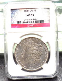 1884 O uncirculated MS 63 graded by NGC Morgan silver dollar: 1884 O uncirculated MS 63 graded by NGC Morgan silver dollar. Please see photos. For in house shipping. Please call Mike at Thriftiques 319-321-0613