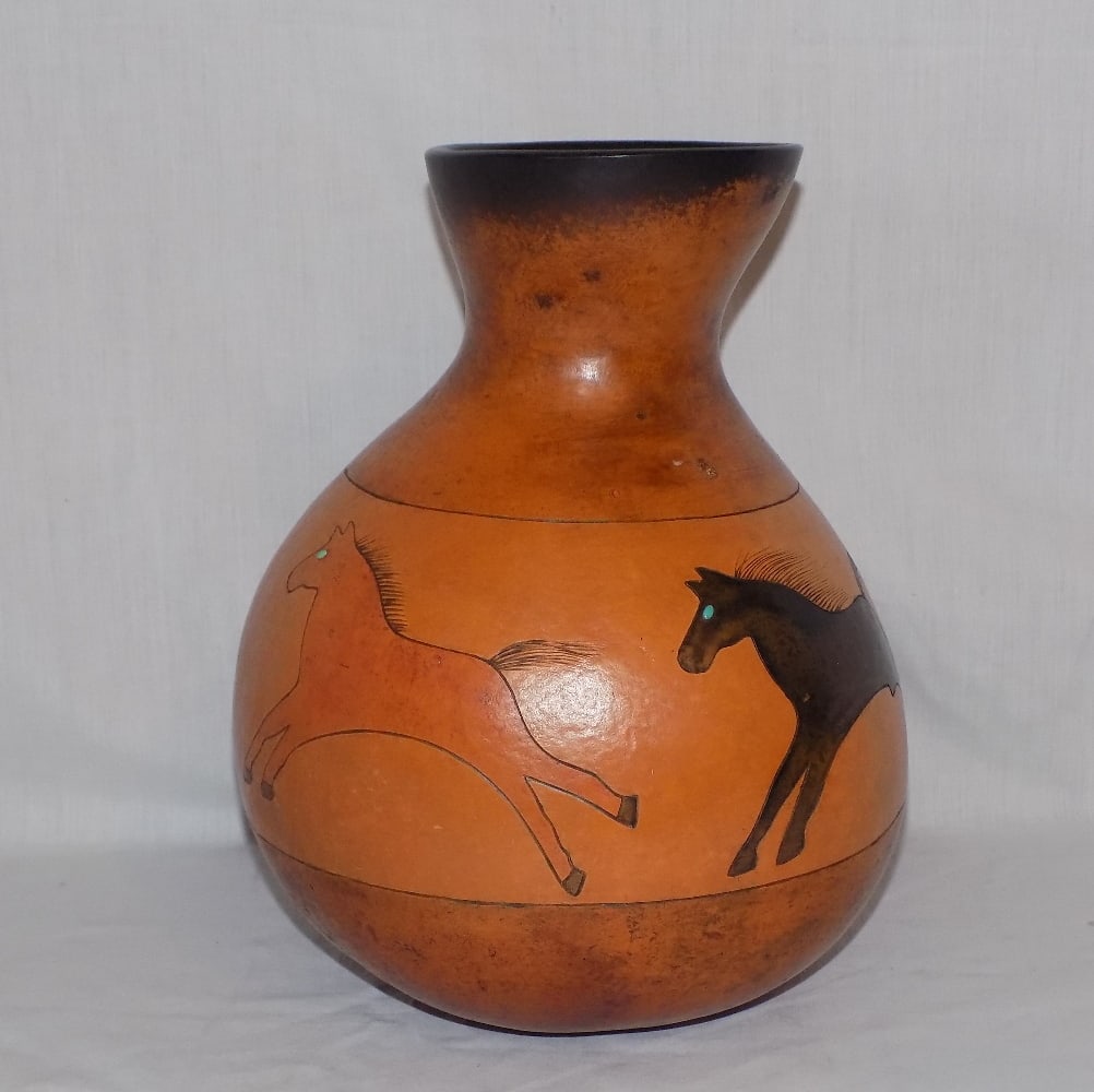 Native American Indian decorated gourde with turquoise.: Native American Indian decorated gourde with turquoise. Artist signed D. R. Nance as shown in photo. In very good original as found condition. Great quality and detail. 11 ¾ tall x 9 wide. For 