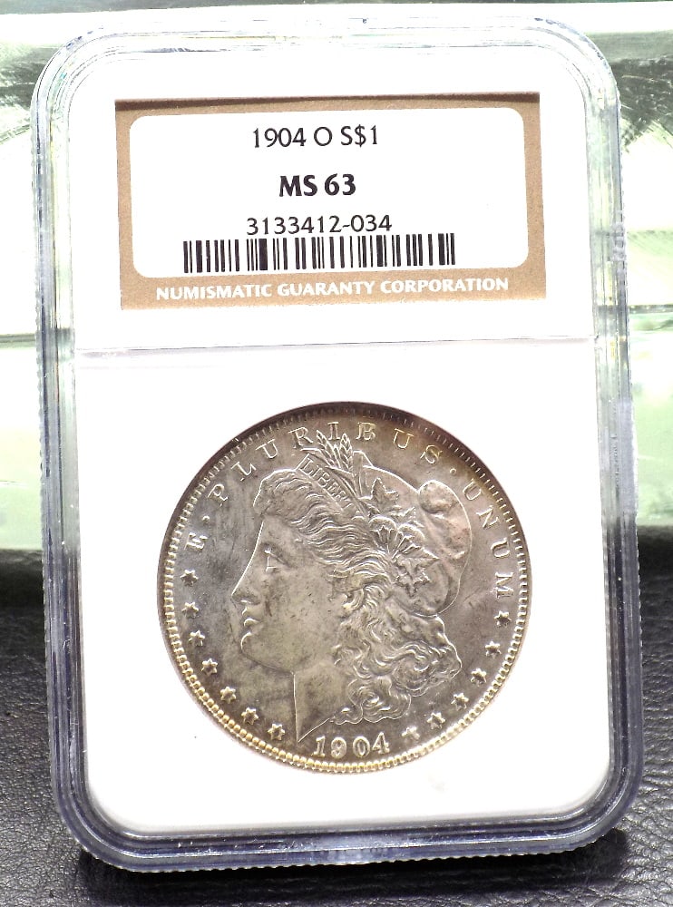 1904 O uncirculated MS 63 graded by NGC Morgan silver dollar (1 of 4)