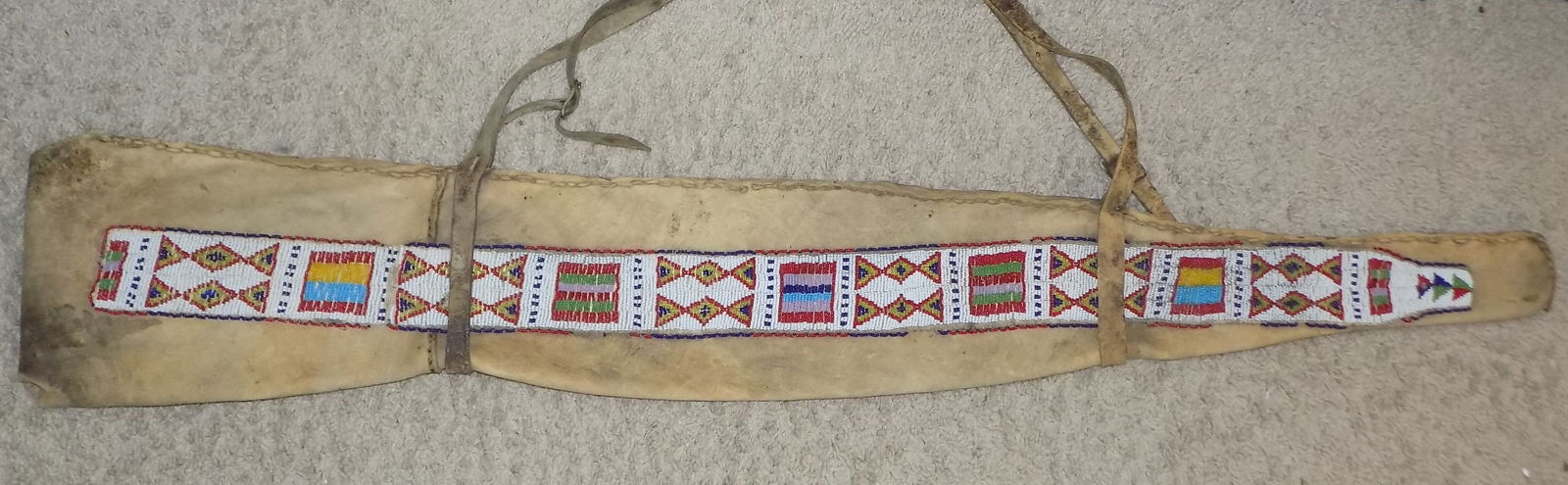 Vintage Native American Indian Cherokee buffalo hide beaded rifle case: Vintage Native American Indian Cherokee buffalo hide beaded rifle case. In very good original as found condition. Great quality and detail. Beaded on one side. Missing a few beads normal use and age.