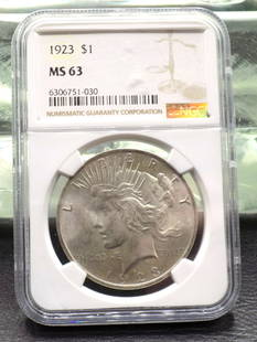 1923 uncirculated graded MS 63 by NGC Peace silver dollar: 1923 uncirculated graded MS 63 by NGC Peace silver dollar. Please see photos. For in house shipping. Please call Mike at Thriftiques 319-321-0613