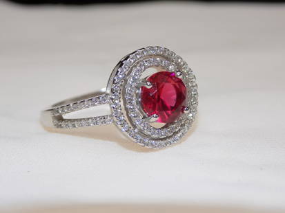 Beautiful 3cwt ruby and white topaz sterling silver ring: Beautiful 3cwt ruby and white topaz sterling silver ring. Lab crated rubies. Size 7. In very good original as found condition. Great quality and detail. For in house shipping. Please call Mike at Thri