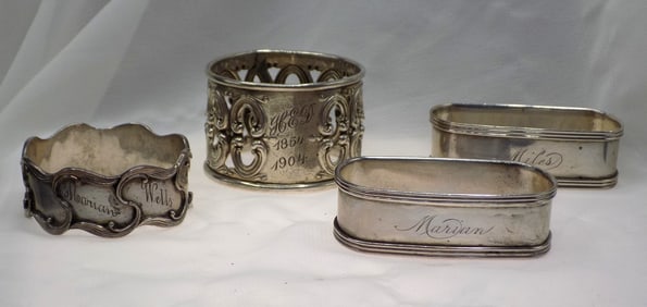Four vintage sterling silver napkin rings