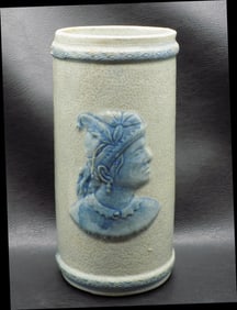 Antique Sleepy Eye pottery vase with dragonfly.