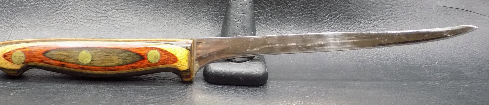 Exceptional vintage Leech Lake Fillet knife and sheath: Exceptional vintage Leech Lake Fillet knife and sheath. Marked on blade as shown in photo. Beautiful colored multi wood handle. In very good original as found condition. Great quality and detail. Leat