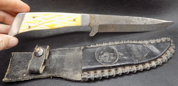 Vintage Bowie style knife with leather sheath