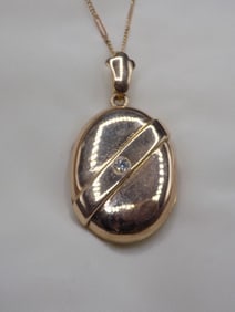1884 gold filled picture locket necklace with diamond and photograph. Locket