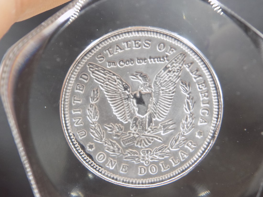 Vintage Morgan Silver Dollar cast Paperweight: Vintage Morgan Silver Dollar cast Paperweight. Marked as shown. 2 ¾ inches wide and 1 5/8 inch tall. In very good original as found condition. Great quality and detail. For in house shipping. P