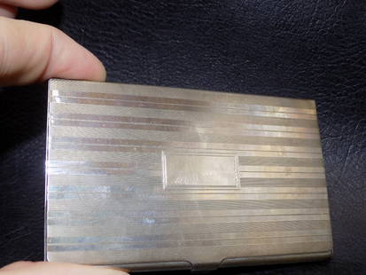 Vintage Signed Tiffany sterling silver Art Deco business card holder: Vintage Signed Tiffany sterling silver Art Deco business card holder with cloth bag. Marked Tiffany and Co Sterling as shown in photo. Tiffany cloth bag. Measure 3 3/8 by 2 &frac14; inches. 64 grams.