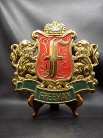 Vintage Freeman cast iron plaque with lions
