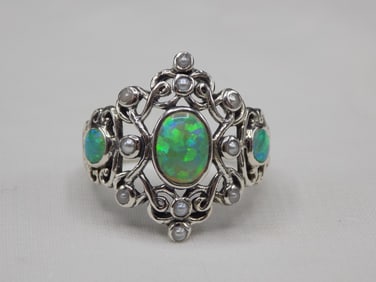 2 cwt fire opal and seed pearl sterling silver ring.