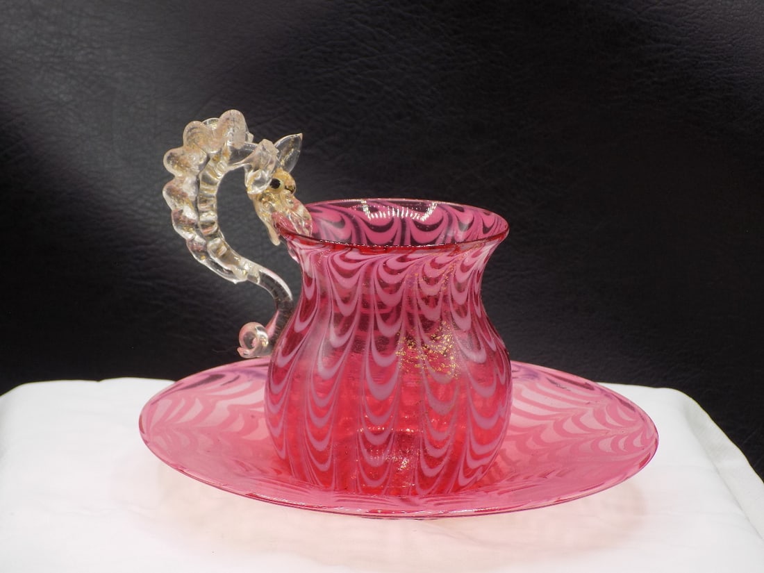Fabulous vintage Venetian Salviati Murano art glass cup and saucer: Fabulous vintage Venetian Salviati Murano art glass cup and saucer. Cup has dragon handle with gold dust and glass eyes. White swirl or spiderweb with gold dust internal decoration. 3 ½ tall to