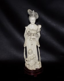 Fabulous carved Oriental figure of lady with lotus blossom and child