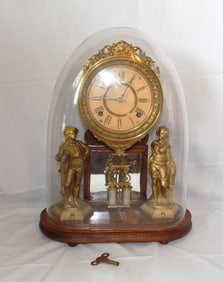 Antique French figural clock with glass dome