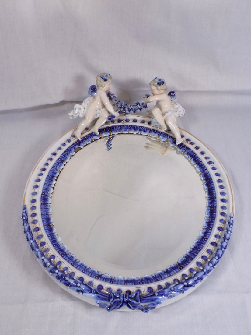 Vintage Meissen porcelain mirror with cupids.: Vintage Meissen porcelain mirror with cupids. Marked as shown in photos. Beautiful colors. In very good original as found condition. Great quality and detail. 13 x 10 ½ inches. For in house shi